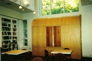 In this multi-use setting at M.I.T. Hillel, the ark is contained in a wall unit that captures the cascading light from the clerestory windows and echoes the cascade with a subtle waterfall sculpture that is seen when the ark is not in use for services. The wall unit contains storage facilities and houses a second, portable ark that is used on the High Holidays.